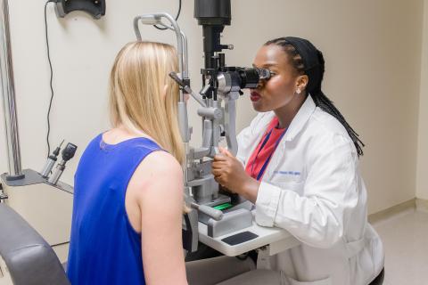 image tagged with patient, exam room, slit lamp, african-american, women, …;