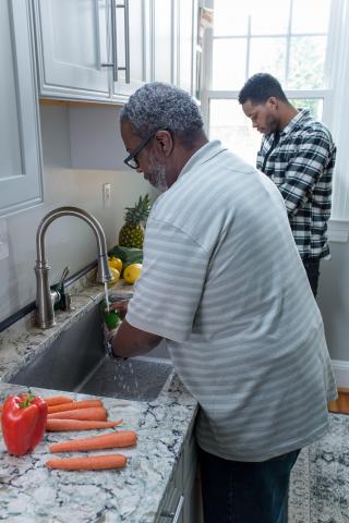 image tagged with carrots, father, bell pepper, guys, kitchen, …;