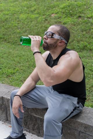 image tagged with sunglasses, man, athletic, rest, drink, …;