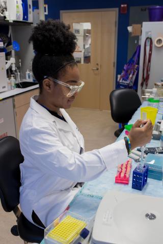 image tagged with pipettes, intern, goggles, african-american, rack, …;