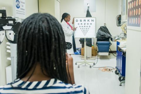 image tagged with vision exam, african-american, patient, eye exam, check up, …;