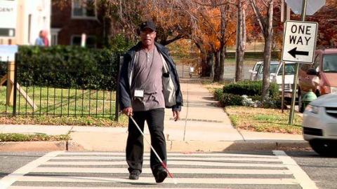 image tagged with african american, walking, man, low vision, cross walk, …;