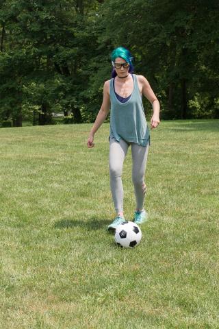 image tagged with soccer, lady, kicking, shoes, gym clothes, …;