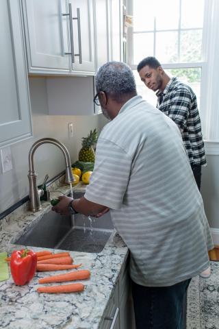 image tagged with african-american, food prep, adult, lemon, men, …;