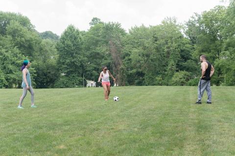 image tagged with field, girl, woman, play, kick, …;
