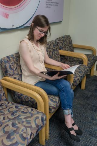 image tagged with booklet, sitting, waiting room, chairs, girl, …;