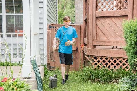image tagged with yard-work, outside, pail, landscaping, boy, …;