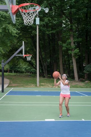 image tagged with glasses, woman, exercising, hoop, shooting, …;