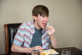 image tagged with table, guy, orange, caucasian, eating, …;
