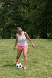 image tagged with playing, physical activity, outdoors, safety glasses, field, …;