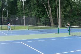 image tagged with exercise, park, racket, serves, shoes, …;