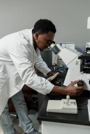 image tagged with male, lab, looks, african-american, microscope, …;
