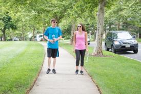 image tagged with trees, couple, tennis shoes, sidewalk, water, …;