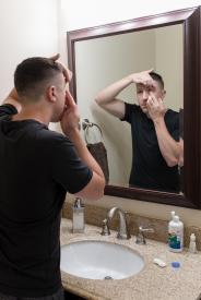image tagged with eye drops, restroom, mirror, guy, young, …;