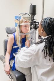 image tagged with exam room, vision, doctor's office, african-american, eye exam, …;