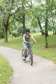 image tagged with park, bike, woman, shoes, bicycle, …;