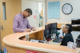 image tagged with check in, african-american, paper, female, doctor's office, …;