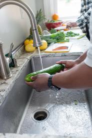 image tagged with kitchen, washes, zucchini, rinses, sink, …;