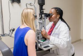 image tagged with medical care, slit lamp, african-american, doctor's office, exam, …;