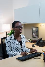 image tagged with glasses, work, african-american, female, sits, …;