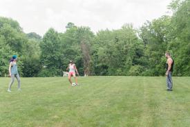 image tagged with woman, field, friends, kicks, play, …;