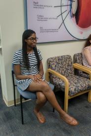 image tagged with girl, sitting, african-american, doctor's office, millennial, …;