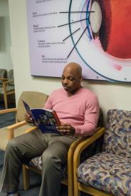 image tagged with clinic, middle aged, african-american, chairs, reads, …;