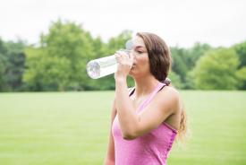 image tagged with girl, lady, field, water bottle, sipping, …;