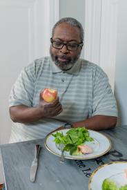 image tagged with sitting, apple, meal, broccoli, bites, …;