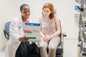 image tagged with patient, doctor's office, ladies, pointing, african-american, …;