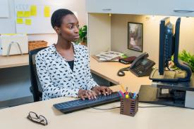 image tagged with african-american, keyboard, woman, researcher, smiles, …;