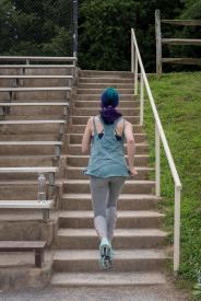 image tagged with stairs, gym clothes, climbing, walks, bleachers, …;