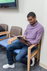 image tagged with waiting room, chair, african-american, millennial, reading, …;
