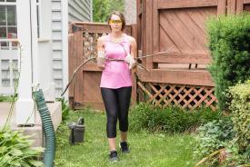 image tagged with walks, woman, caucasian, standing, yard, …;