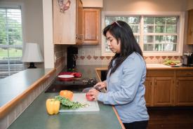 image tagged with cutting, latina, leafy greens, woman, kitchen, …;