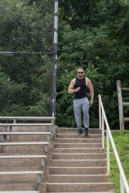 image tagged with bottle, climbs, man, exercises, stairs, …;