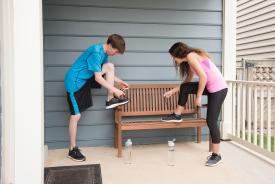 image tagged with bench, siblings, tennis shoes, man, water, …;