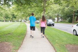 image tagged with sidewalk, outside, walking, outdoors, siblings, …;