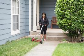 image tagged with female, mowing, hispanic, landscape, garden, …;