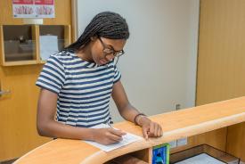 image tagged with doctor's office, girl, african-american, doctor's appointment, paperwork, …;