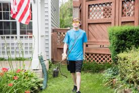 image tagged with pail, boy, garden, yard-work, glasses, …;