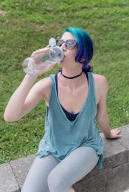 image tagged with bottle, sits, thirsty, field, park, …;