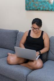 image tagged with laptop, female, works, sofa, computer, …;