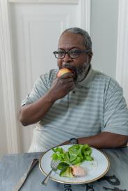 image tagged with dinner, african-american, apple, middle aged, bite, …;