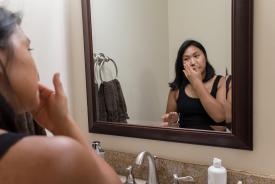 image tagged with female, woman, mirror, asian-american, scrubbing, …;