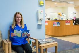 image tagged with waiting, woman, doctor's office, caucasian, book, …;