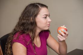 image tagged with apple, holds, food, lady, sit, …;