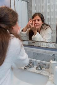 image tagged with eye care, sink, putting, mirror, woman, …;
