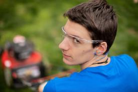 image tagged with teen, safety glasses, lawn care, yard work, lawn mowing