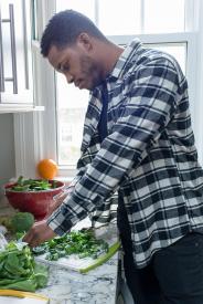 image tagged with chops, leafy greens, african-american, counter, prepare, …;